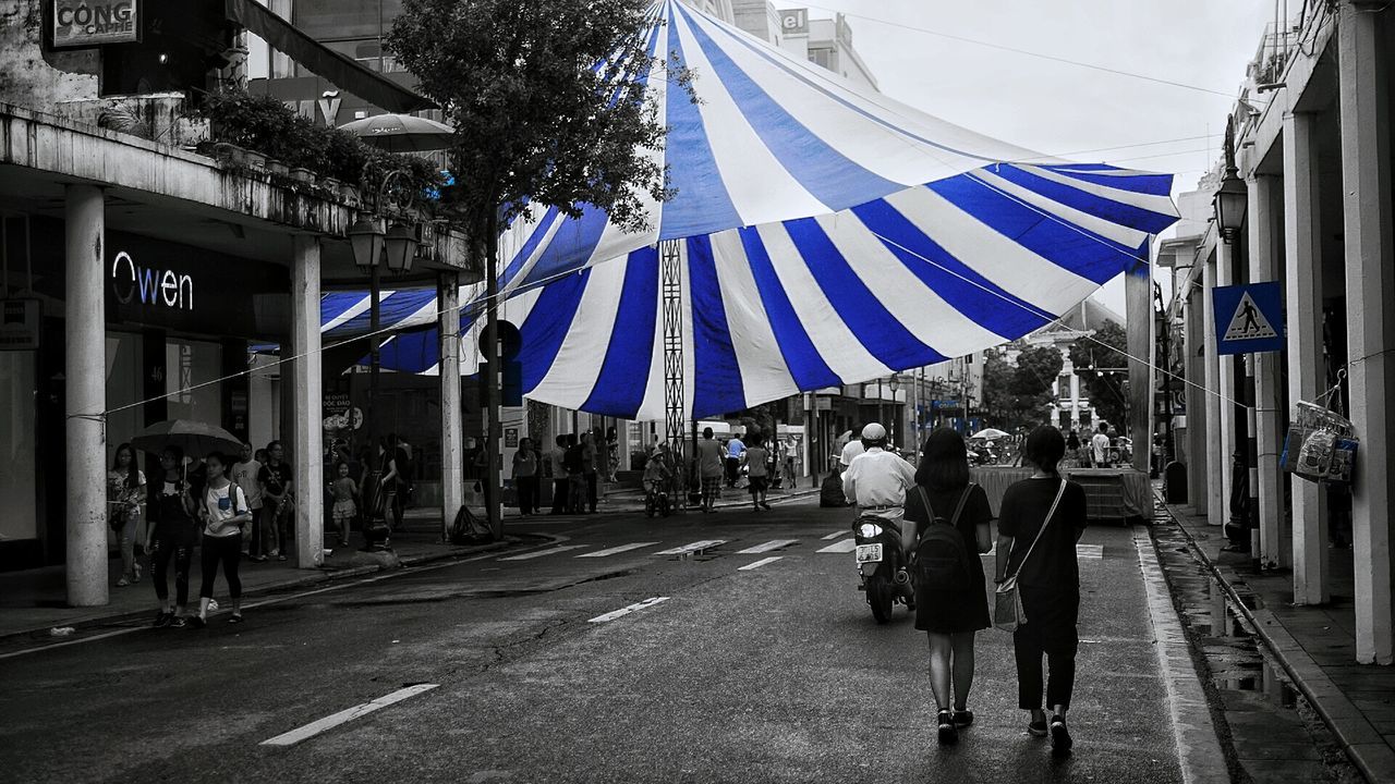 VIEW OF PEOPLE WALKING ON FOOTPATH