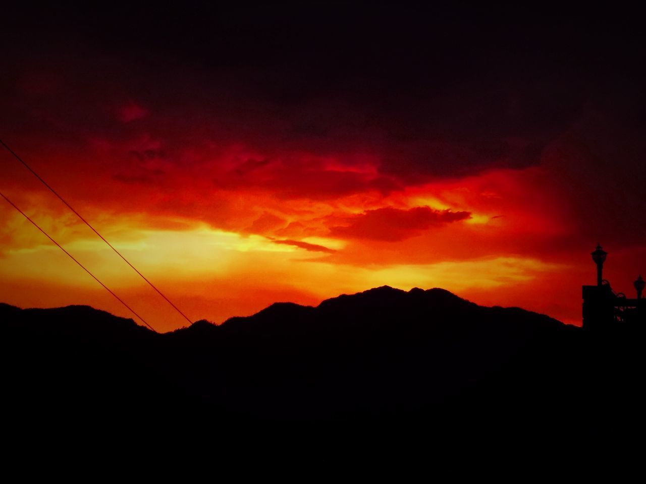 SILHOUETTE MOUNTAINS AGAINST SKY DURING SUNSET