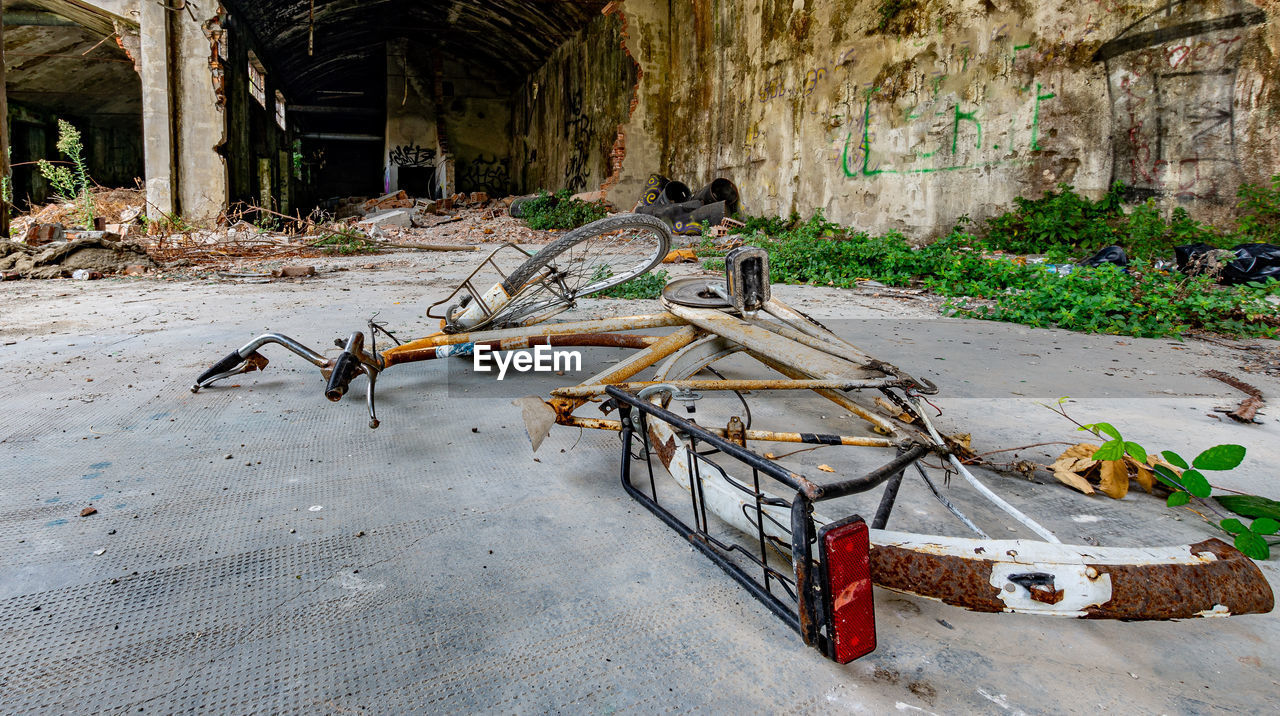 ABANDONED HORSE CART ON WALL