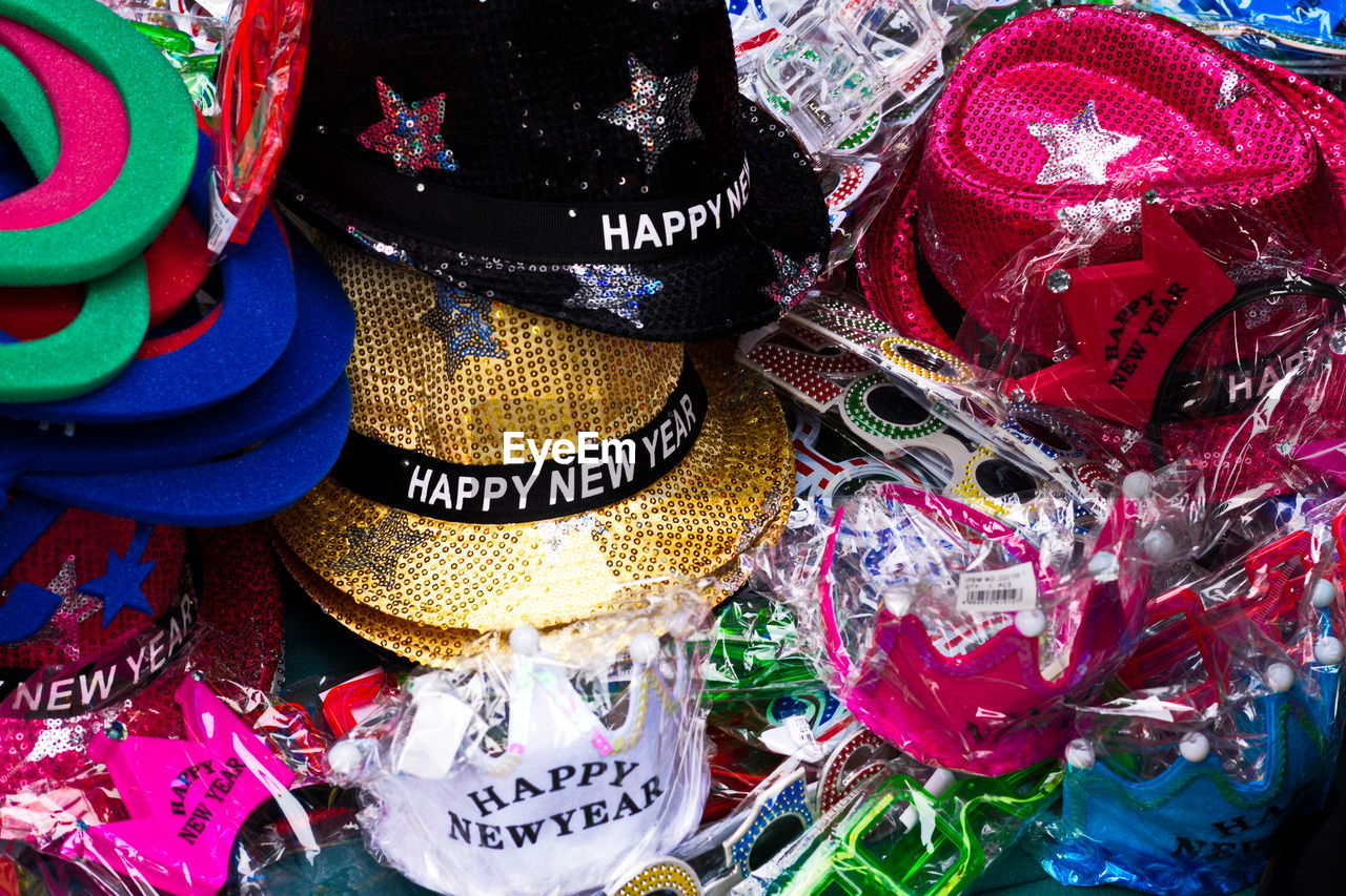 High angle view of colorful hats at market for sale