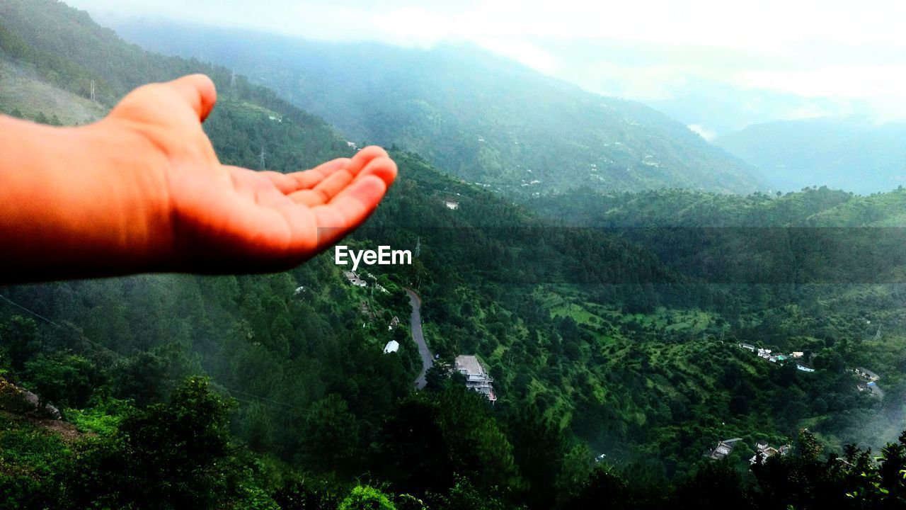 CLOSE-UP OF MAN ON MOUNTAIN