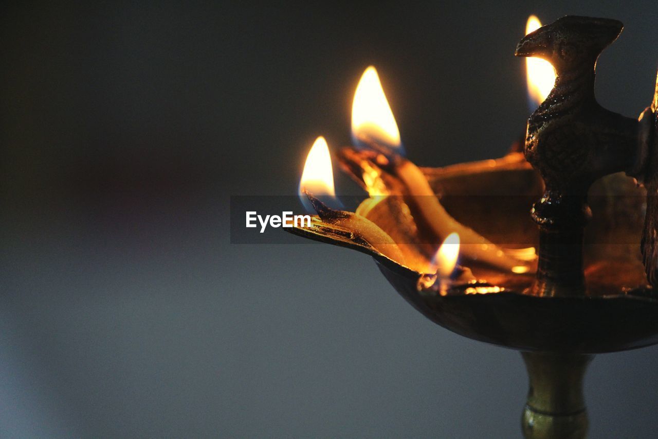 Close-up of lit diya