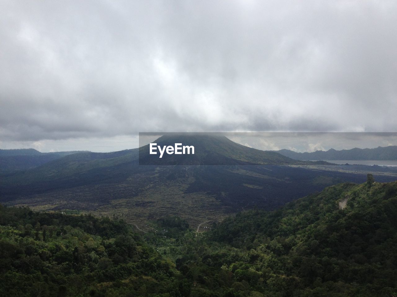 SCENIC VIEW OF GREEN LANDSCAPE AGAINST SKY