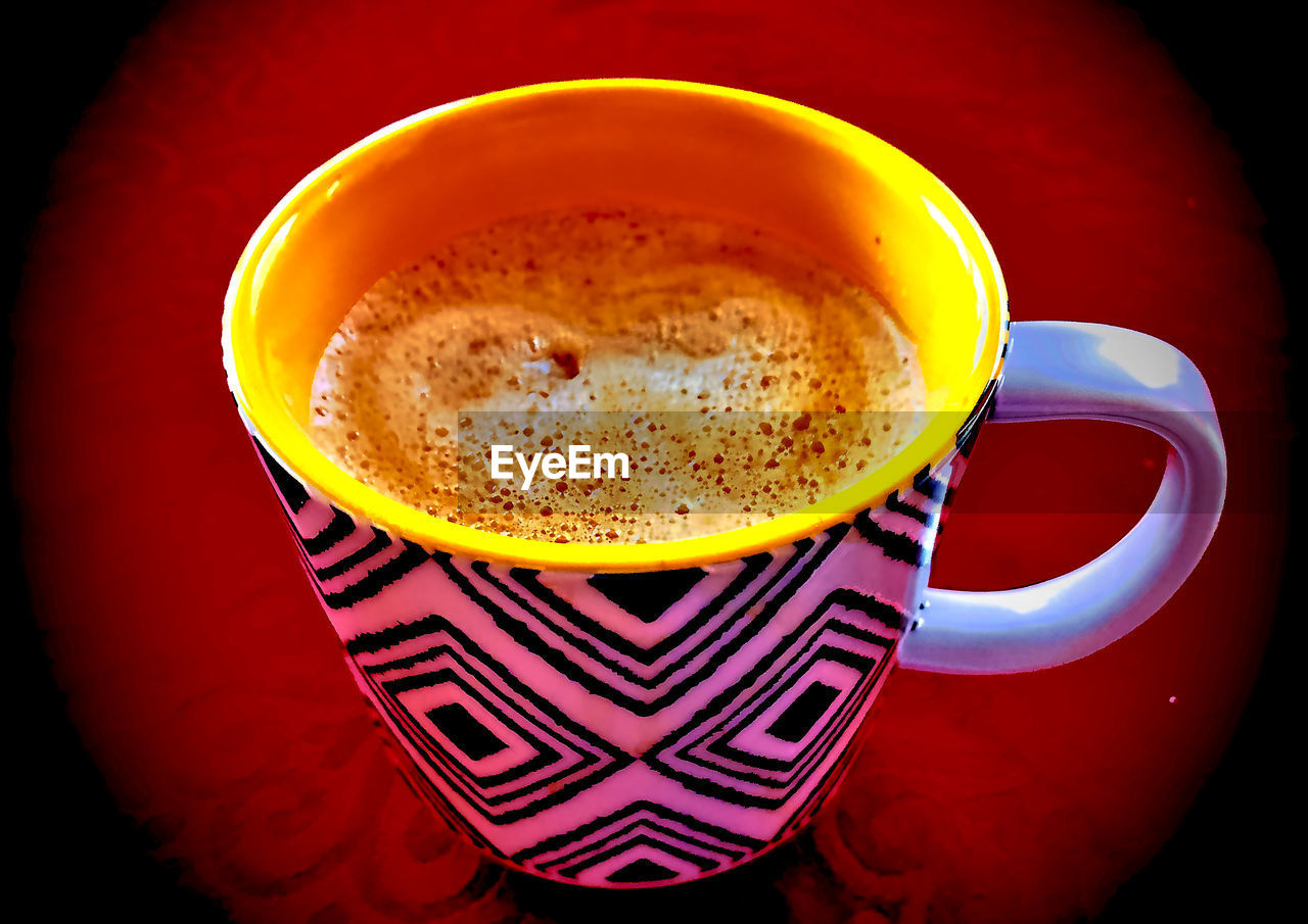 CLOSE-UP OF COFFEE CUP ON TABLE