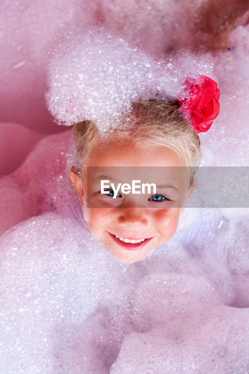 pink, child, portrait, childhood, smiling, bathtub, looking at camera, happiness, one person, soap sud, emotion, skin, cheerful, nature, fun, bubble bath, innocence, taking a bath, headshot, domestic bathroom, bathroom, indoors, cute, domestic room, women, enjoyment, human face, water, female, bubble, baby, toddler, front view, person, positive emotion, lifestyles, joy, teeth, smile, lip, washing, hygiene, high angle view