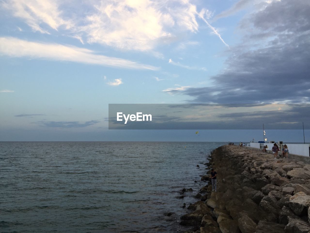 SCENIC VIEW OF ROCKS ON SEA AGAINST SKY