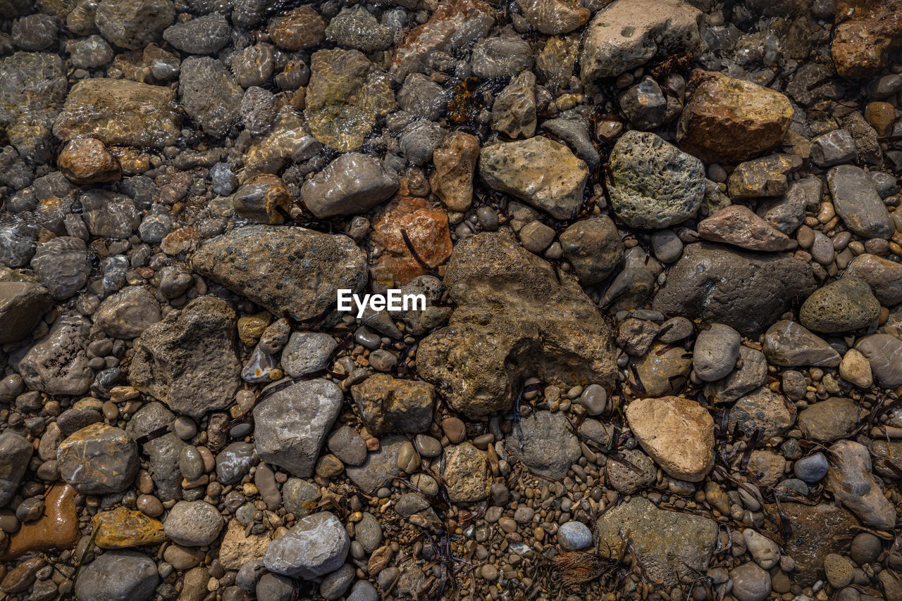 soil, backgrounds, full frame, rock, nature, textured, no people, wall, land, stone wall, day, pattern, outdoors, high angle view, rubble, rough, stone, field, environment, climate, asphalt, gravel, close-up, arid climate, drought, cracked, dry, road surface, wood, abundance, geology, sunlight