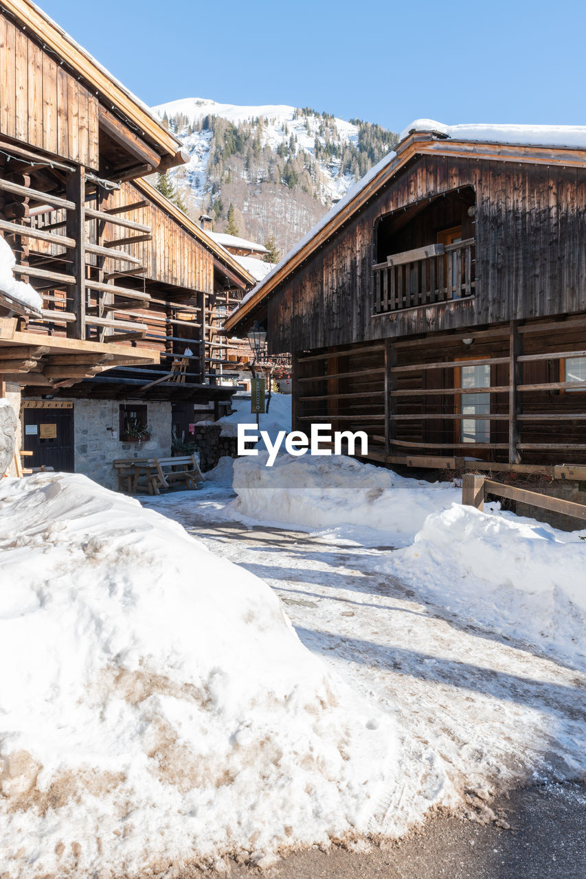 Winter magic. the ancient wooden houses of sauris di sopra. italy