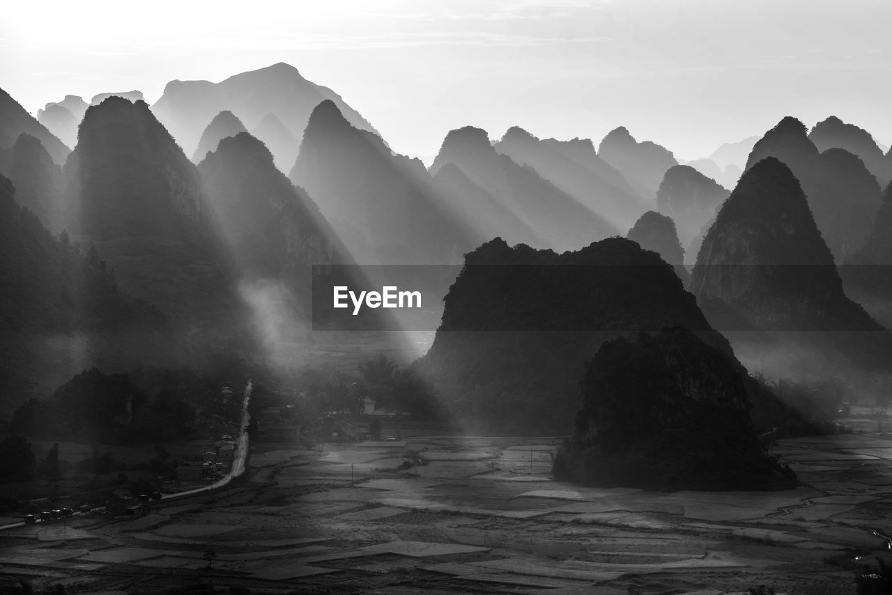 Scenic view of rocks in mountains against sky