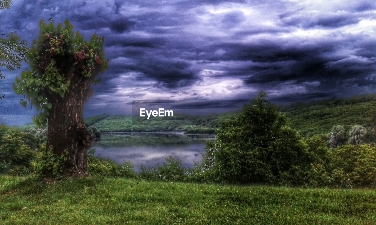 SCENIC VIEW OF LANDSCAPE AGAINST CLOUDY SKY