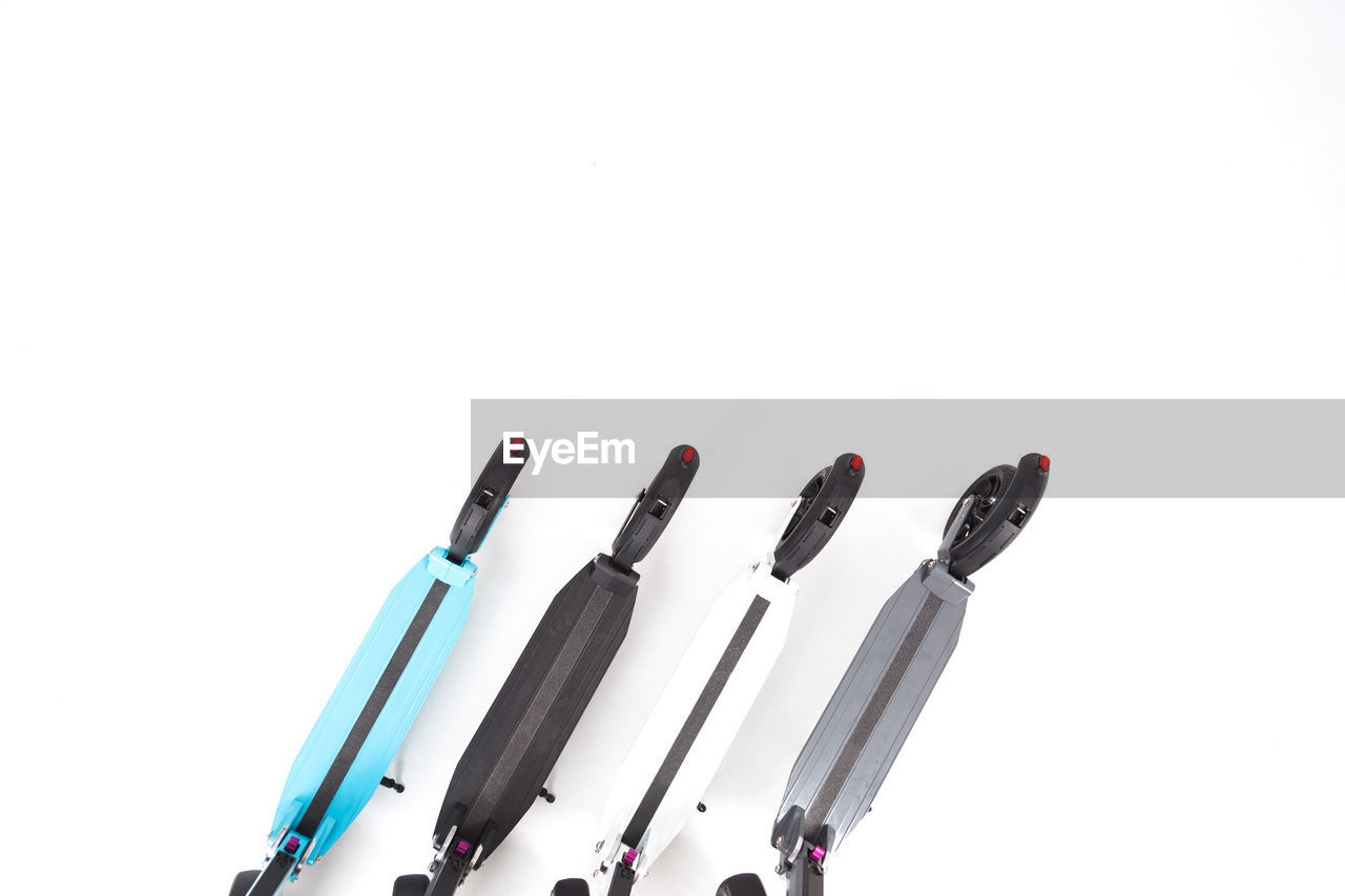 HIGH ANGLE VIEW OF CABLES AGAINST WHITE BACKGROUND
