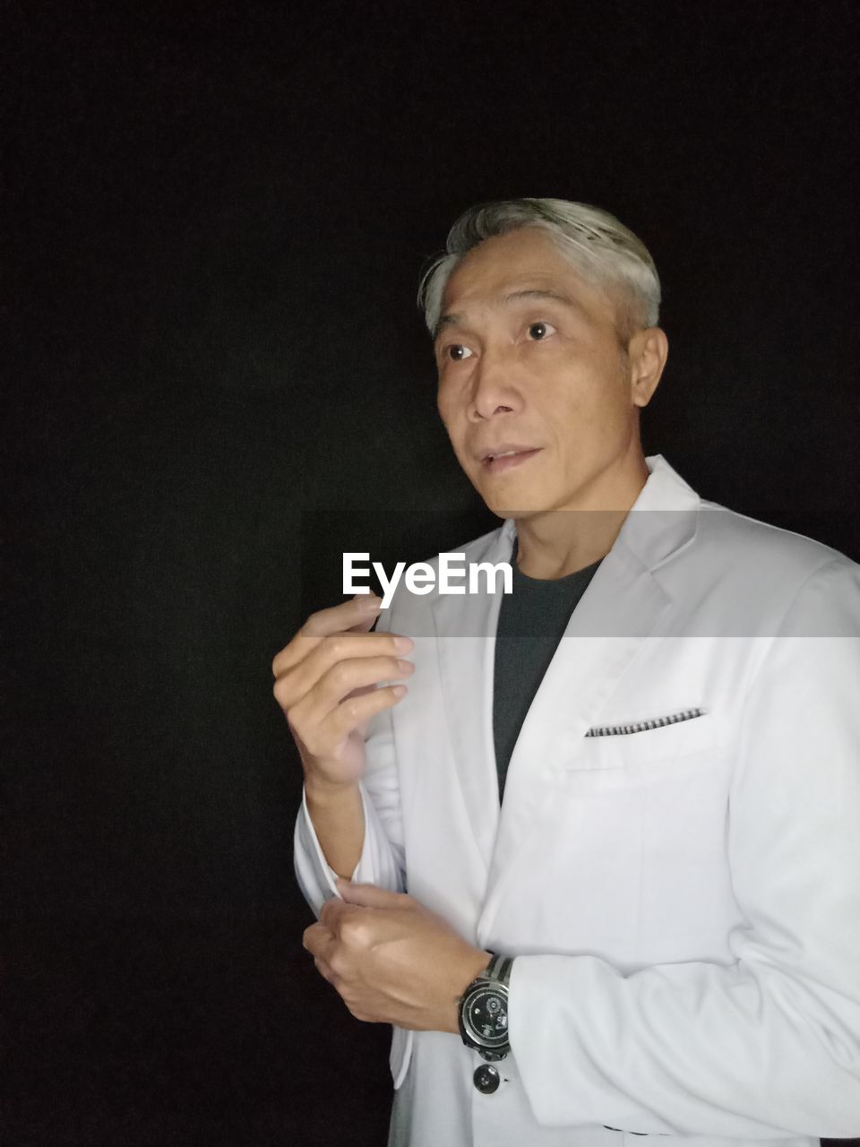 one person, adult, studio shot, portrait, indoors, looking at camera, black background, mature adult, person, waist up, men, occupation, serious, standing, clothing, lab coat, gray hair, healthcare and medicine, front view, business, copy space, professional occupation, doctor