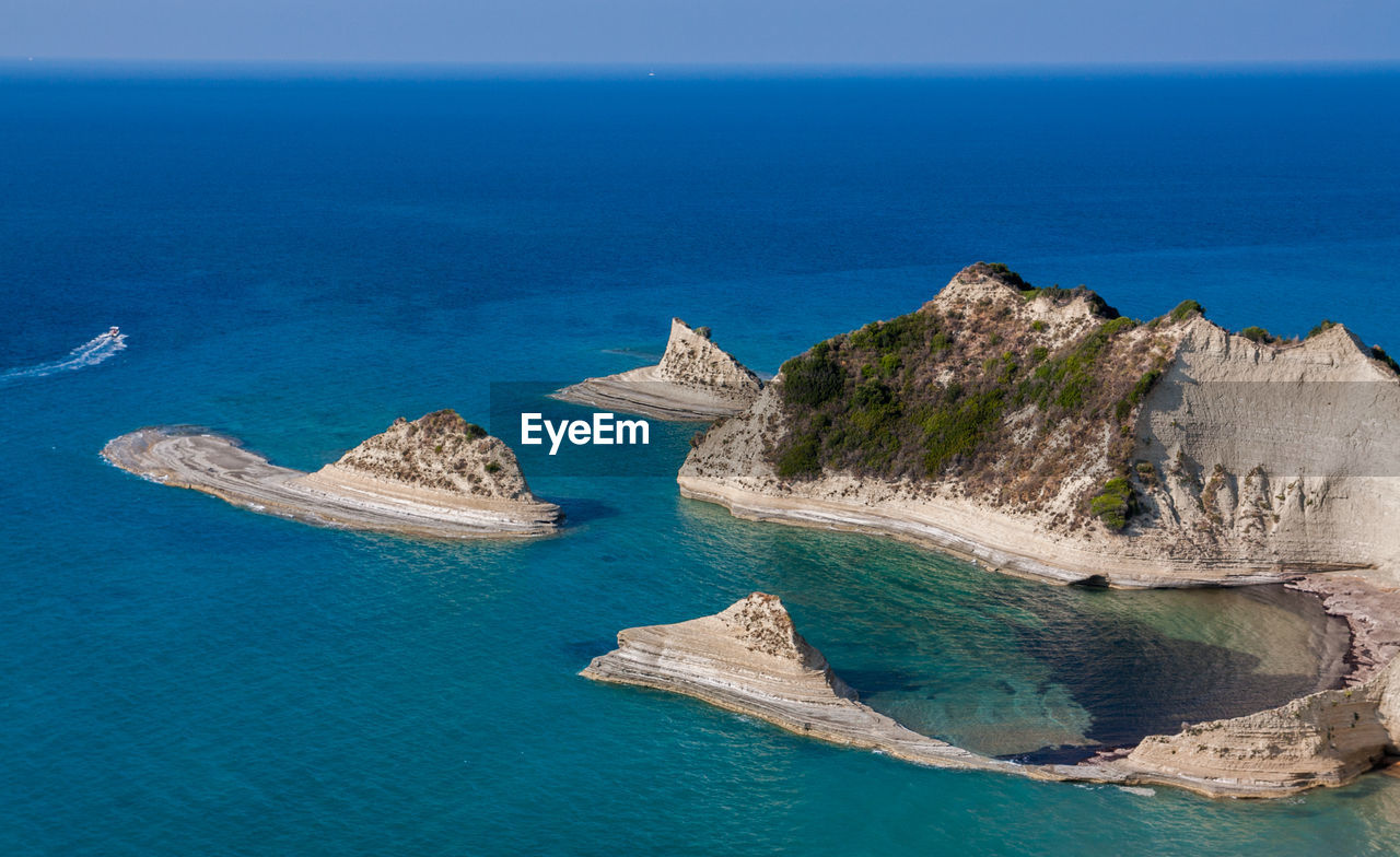 Panoramic view of sea against blue sky