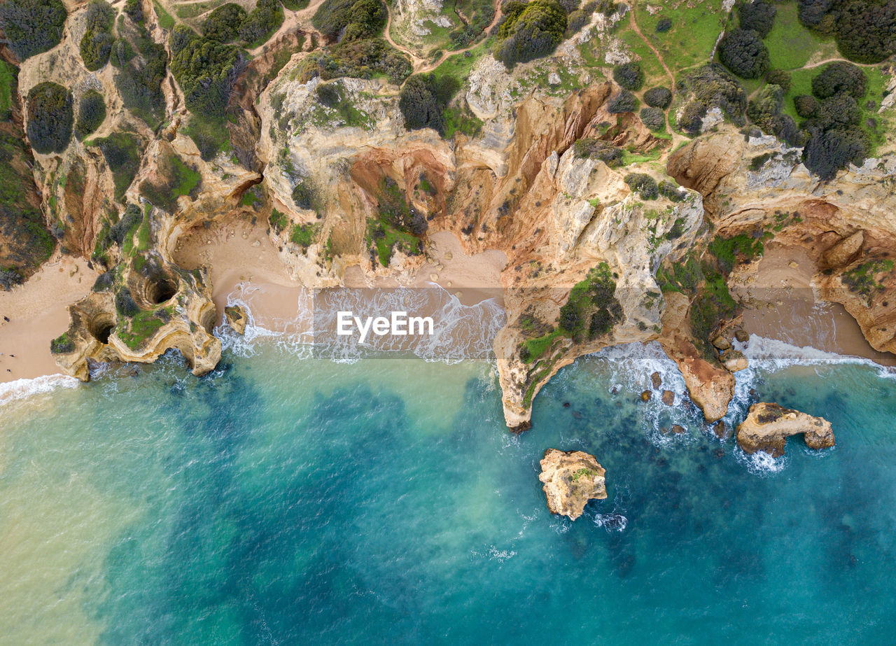 High angle view of rocks in sea