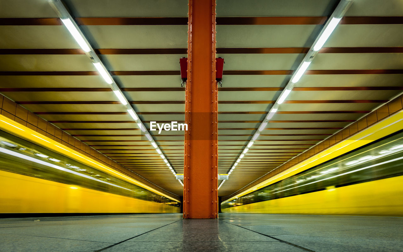 Speeding blurred trains at underground railway station