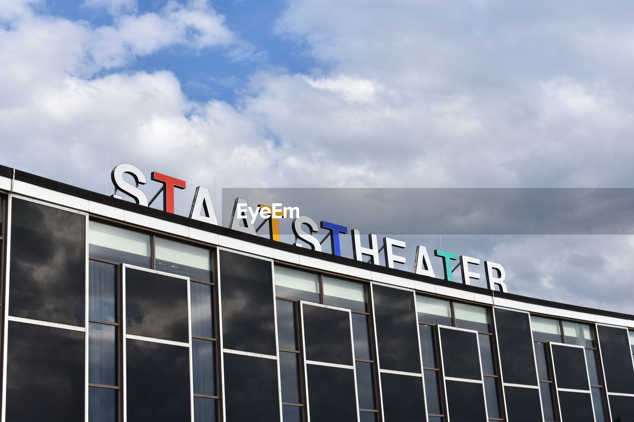 LOW ANGLE VIEW OF SIGN AGAINST SKY