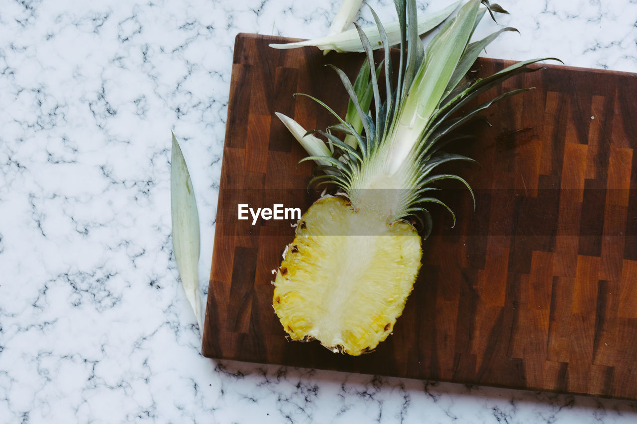 Directly above shot of pineapple on cutting board