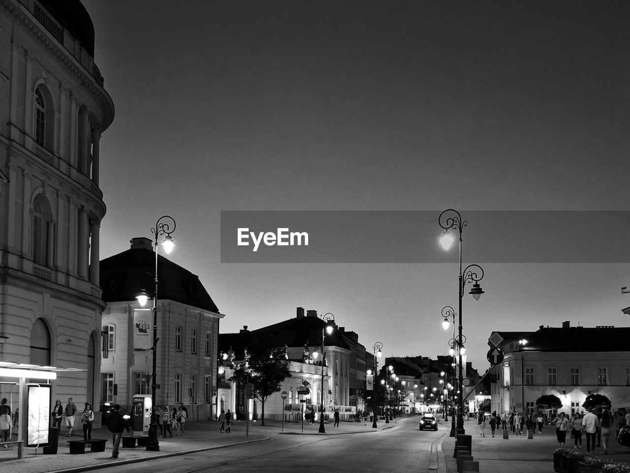 illuminated street light against clear sky