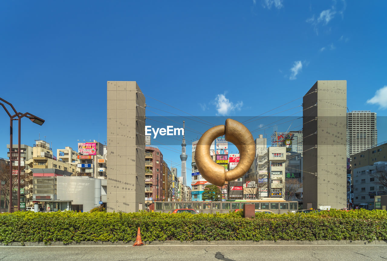 LOW ANGLE VIEW OF MODERN BUILDINGS AGAINST CLEAR BLUE SKY