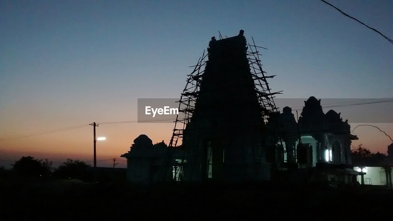 Low angle view of temple against sky at dusk