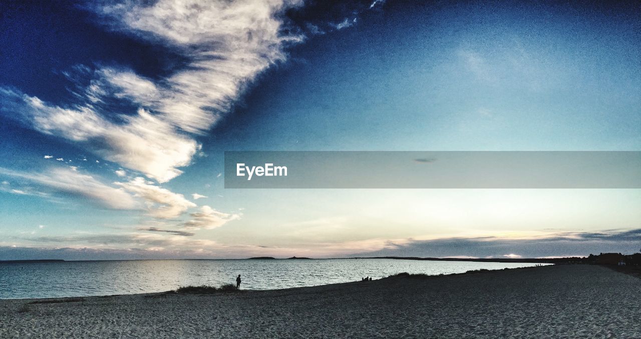 VIEW OF SEA AGAINST CLOUDY SKY