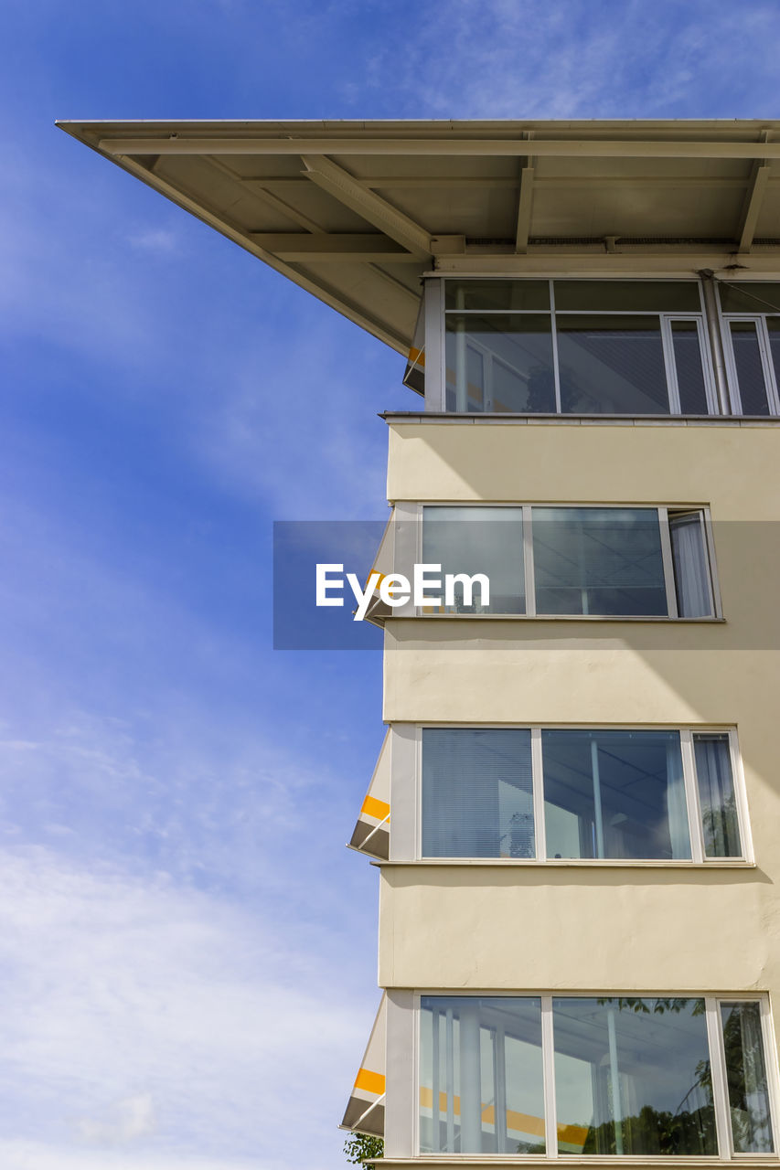 Modern residential building with a blue sky