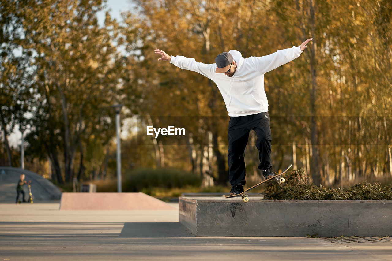 Full length of man skateboarding on skateboard park