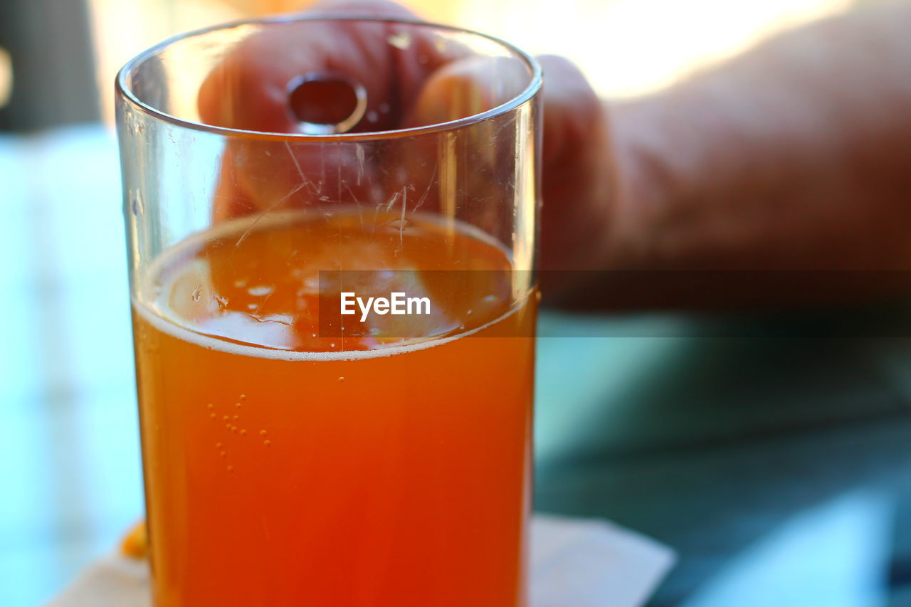 CLOSE-UP OF COCKTAIL ON TABLE