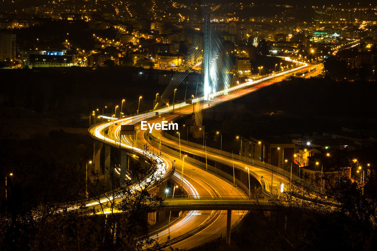 High angle view of light trails on road at night