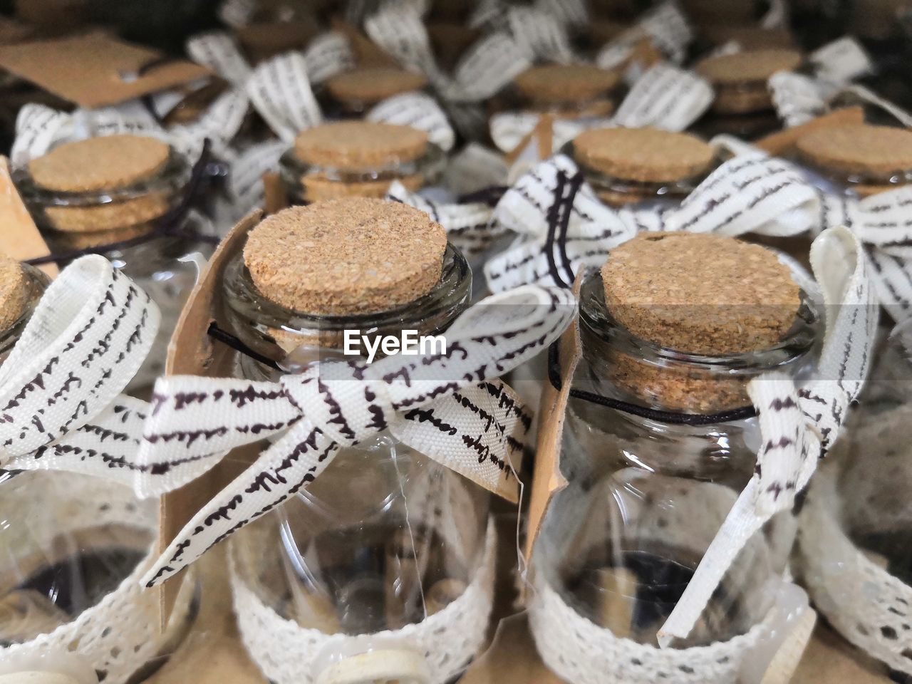 Close-up of ribbons on jars