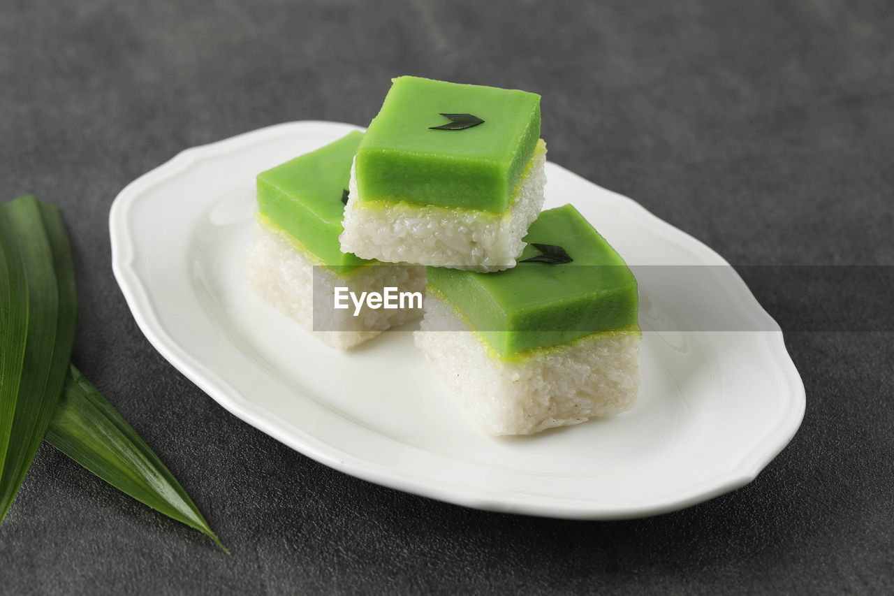 Kuih talam made of pandan leaf and coconut, malaysia traditional snacks from peranakan culture