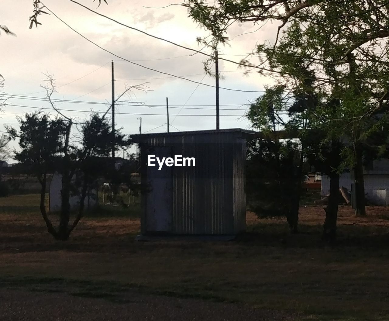 BUILT STRUCTURE ON FIELD AGAINST SKY