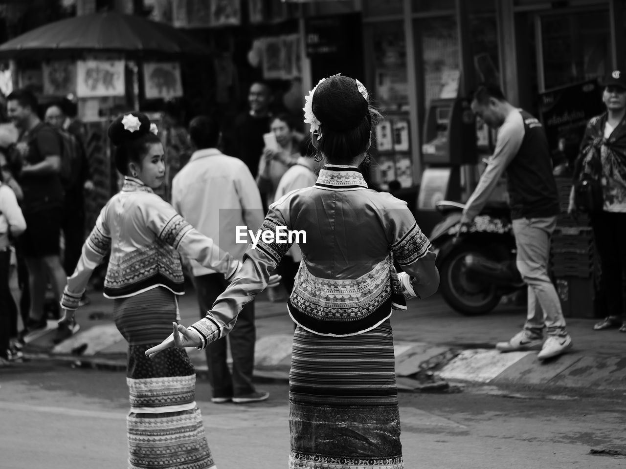 PEOPLE WALKING ON STREET IN CITY