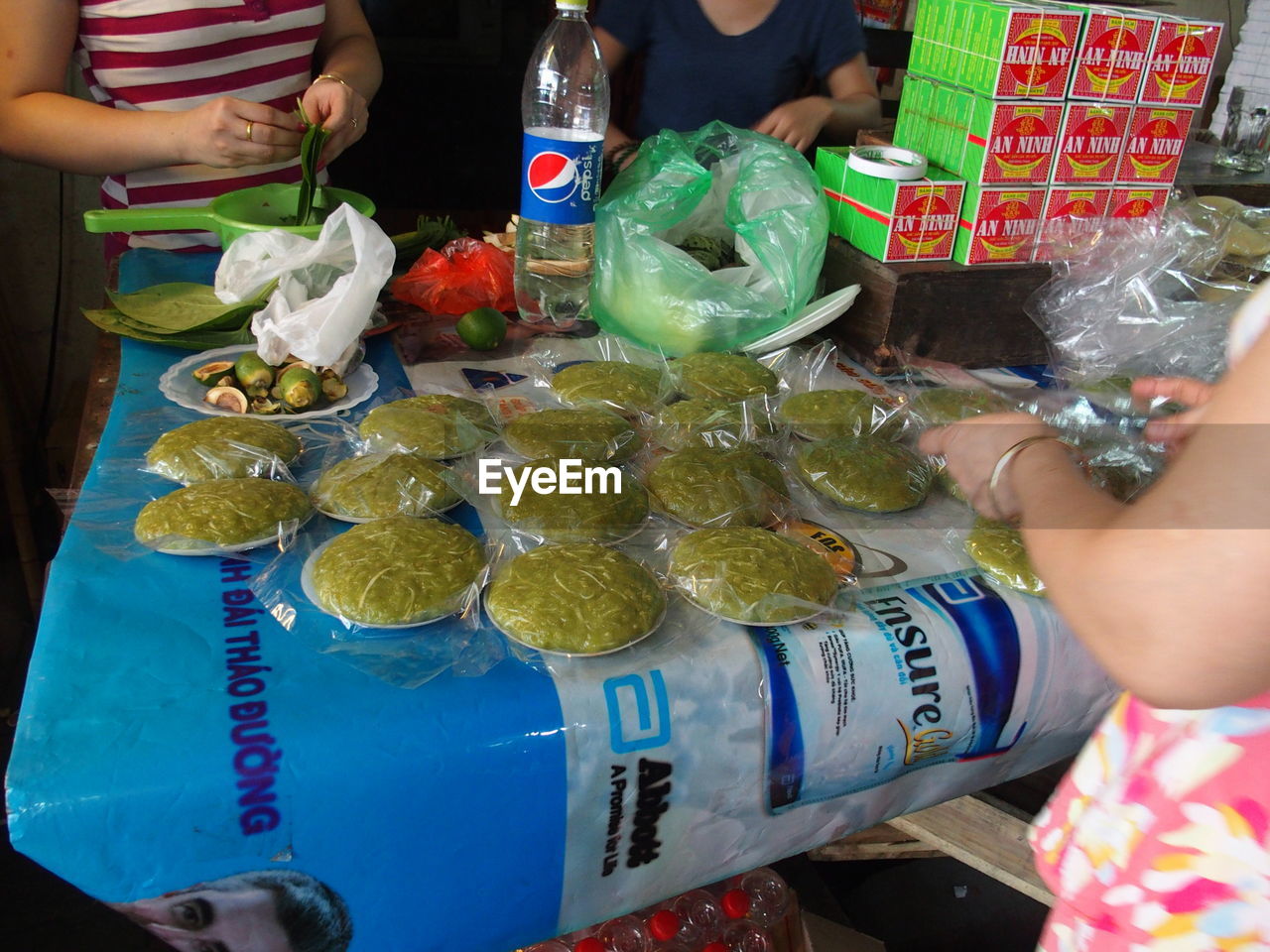 Cropped image of woman buying food from market stall