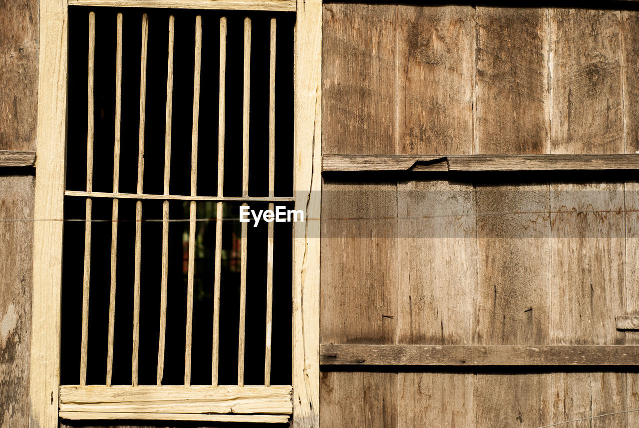 Full frame shot of window on wooden wall