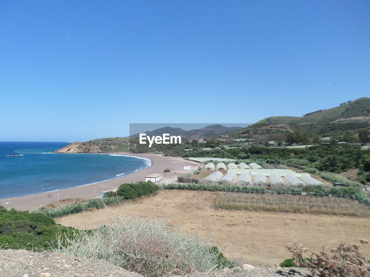 PANORAMIC SHOT OF SEA AGAINST CLEAR BLUE SKY