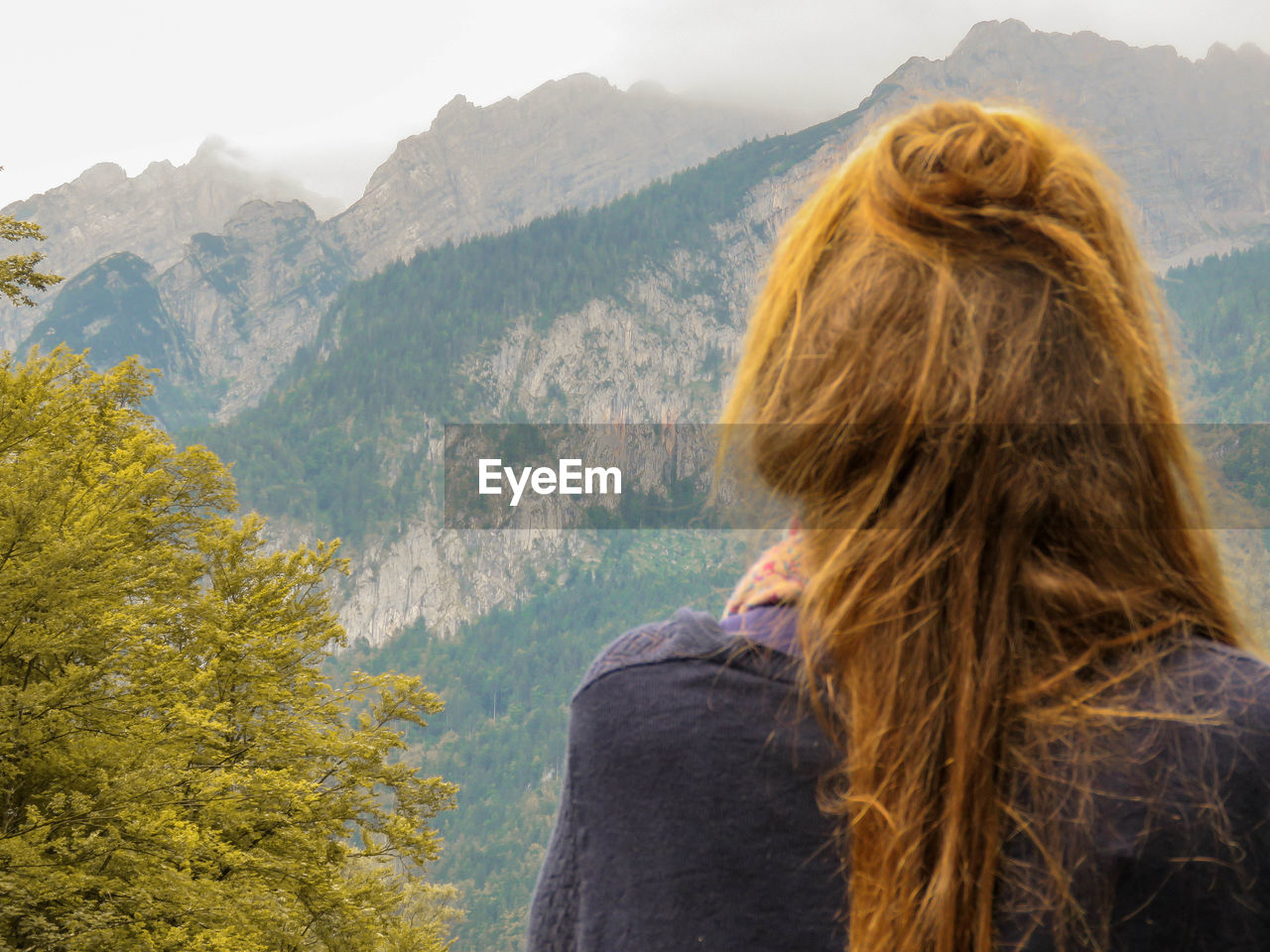 Rear view of woman looking at mountains