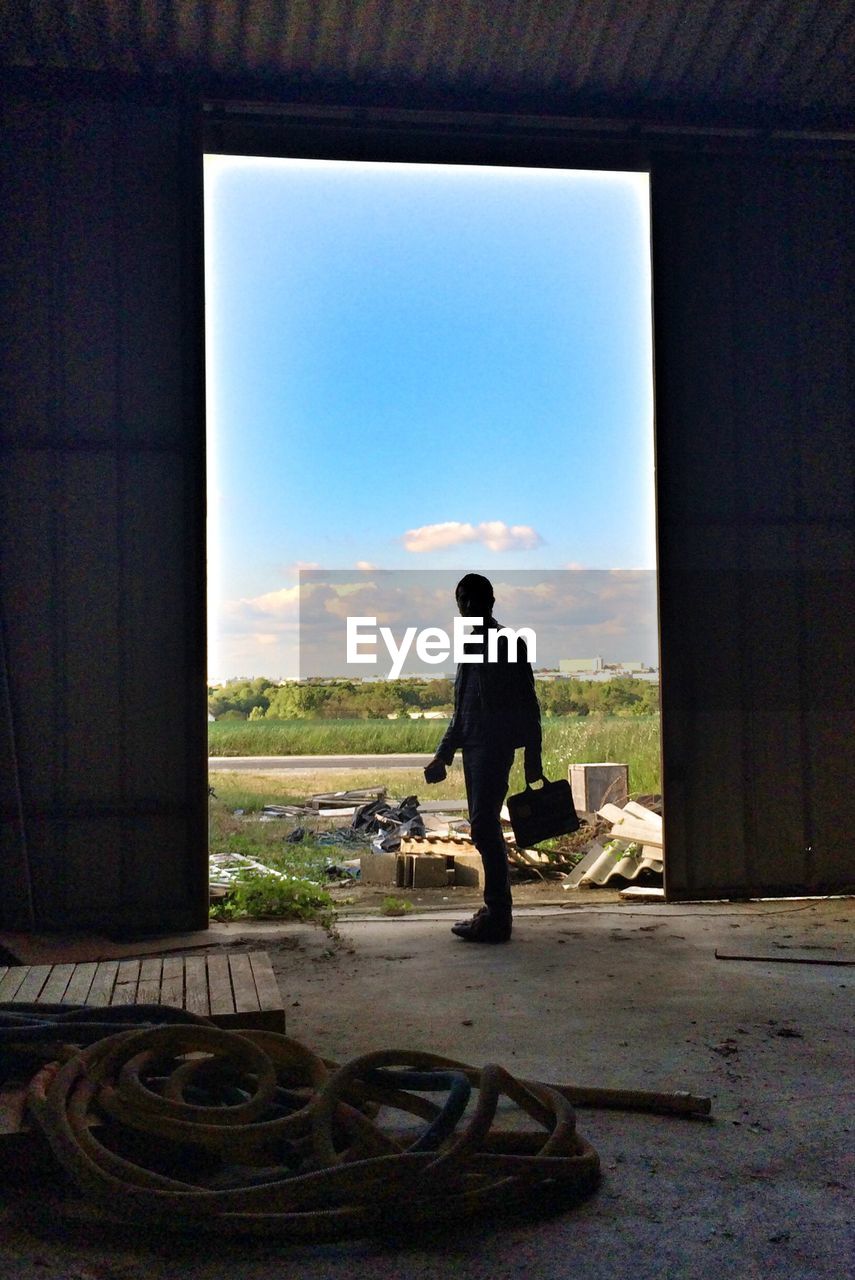 Full length of man standing in doorway