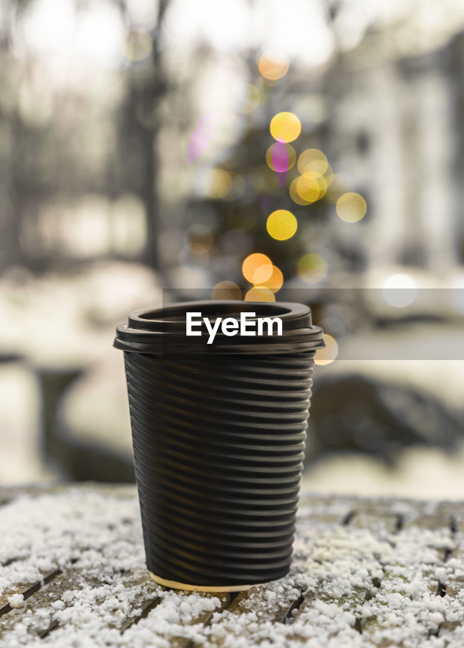 Takeaway disposable cup for hot drink on table. street walk cafe. empty space for text, mockup. 