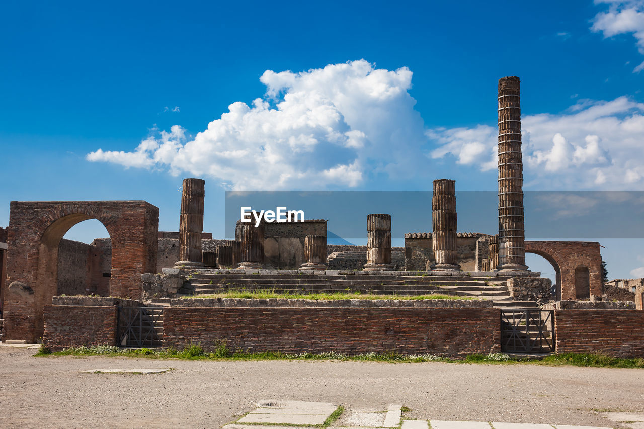 Temple of jupiter at the forum of the ancient city of pompeii in a beautiful early spring day