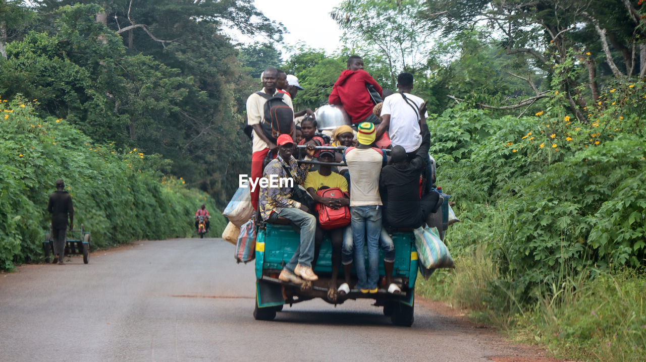 PEOPLE RIDING BICYCLES ON ROAD