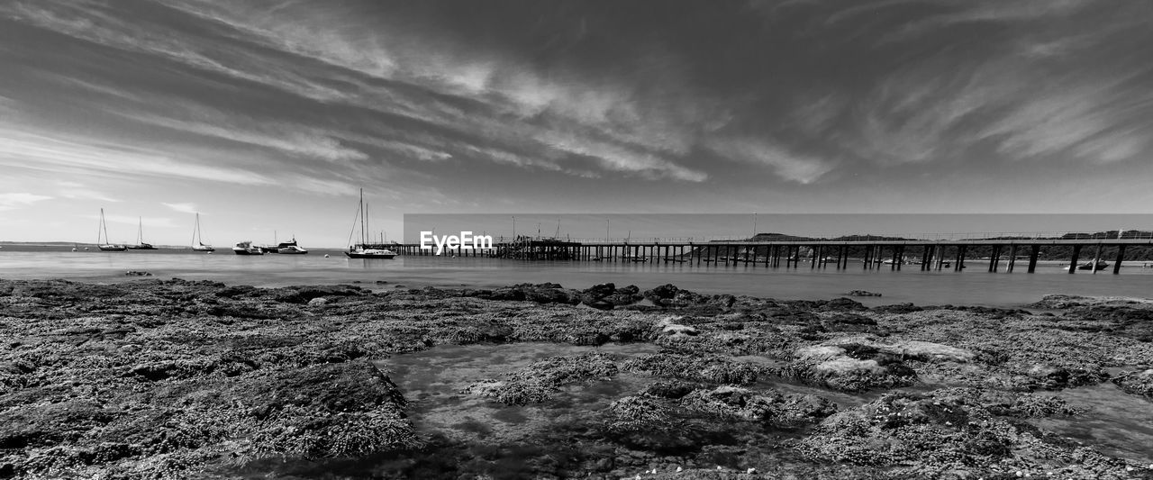 Pier over sea against sky