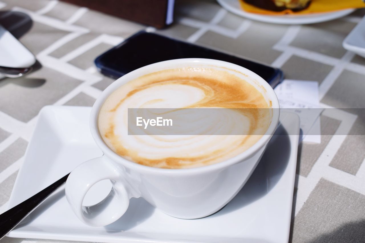 High angle view of cappuccino on table