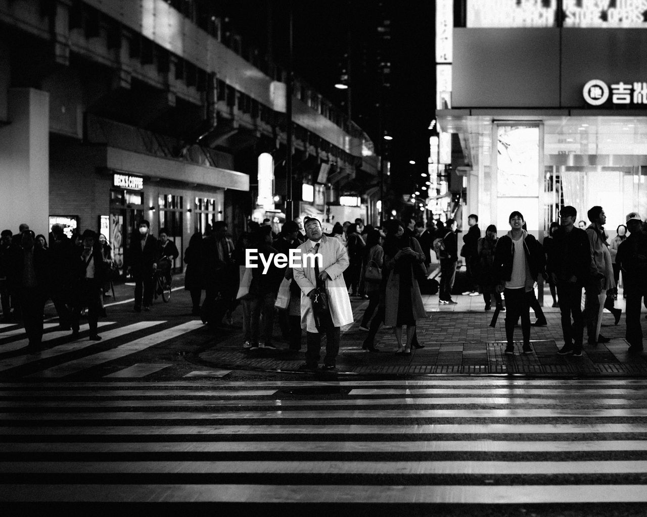 GROUP OF PEOPLE CROSSING ROAD