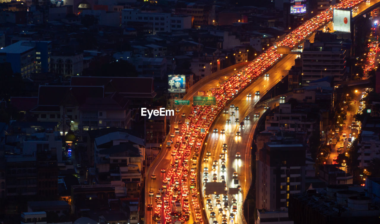 high angle view of illuminated cityscape at night