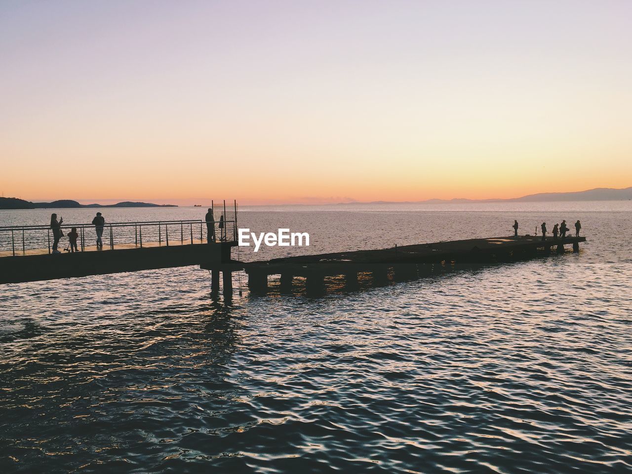 Scenic view of sea against clear sky during sunset