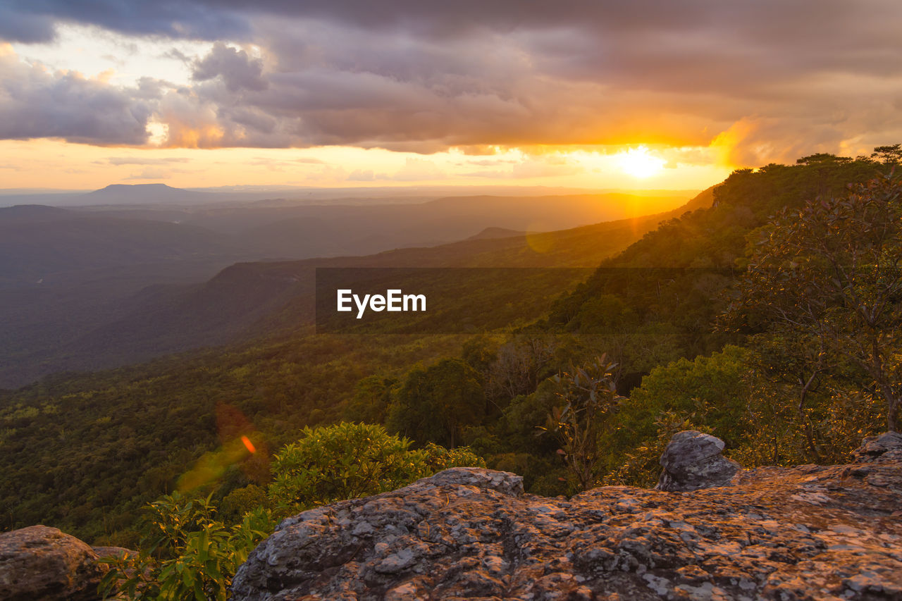 SCENIC VIEW OF ROCKY MOUNTAINS DURING SUNSET