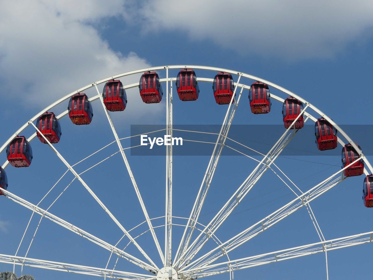 Low angle view of ferris wheel against sky