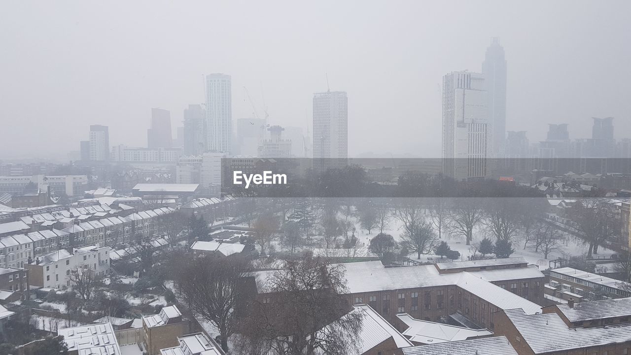 CITYSCAPE AGAINST SKY DURING WINTER