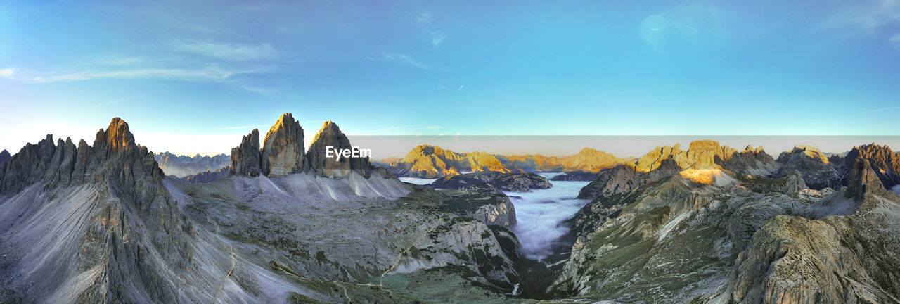 Tre cime di lavaredo - drei zinnen aerial panoramic overview from above in the first light